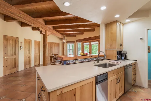 a kitchen with a stove a sink and a refrigerator