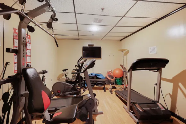 a view of parking garage with cars