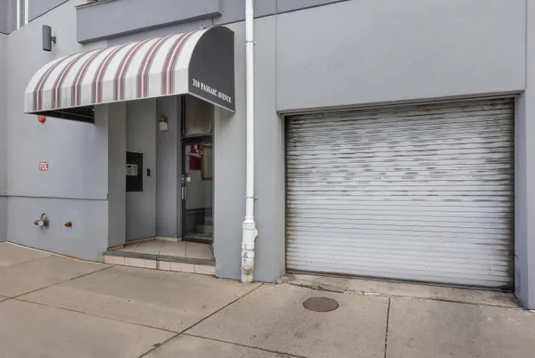 a view of a house with entryway and wooden walls