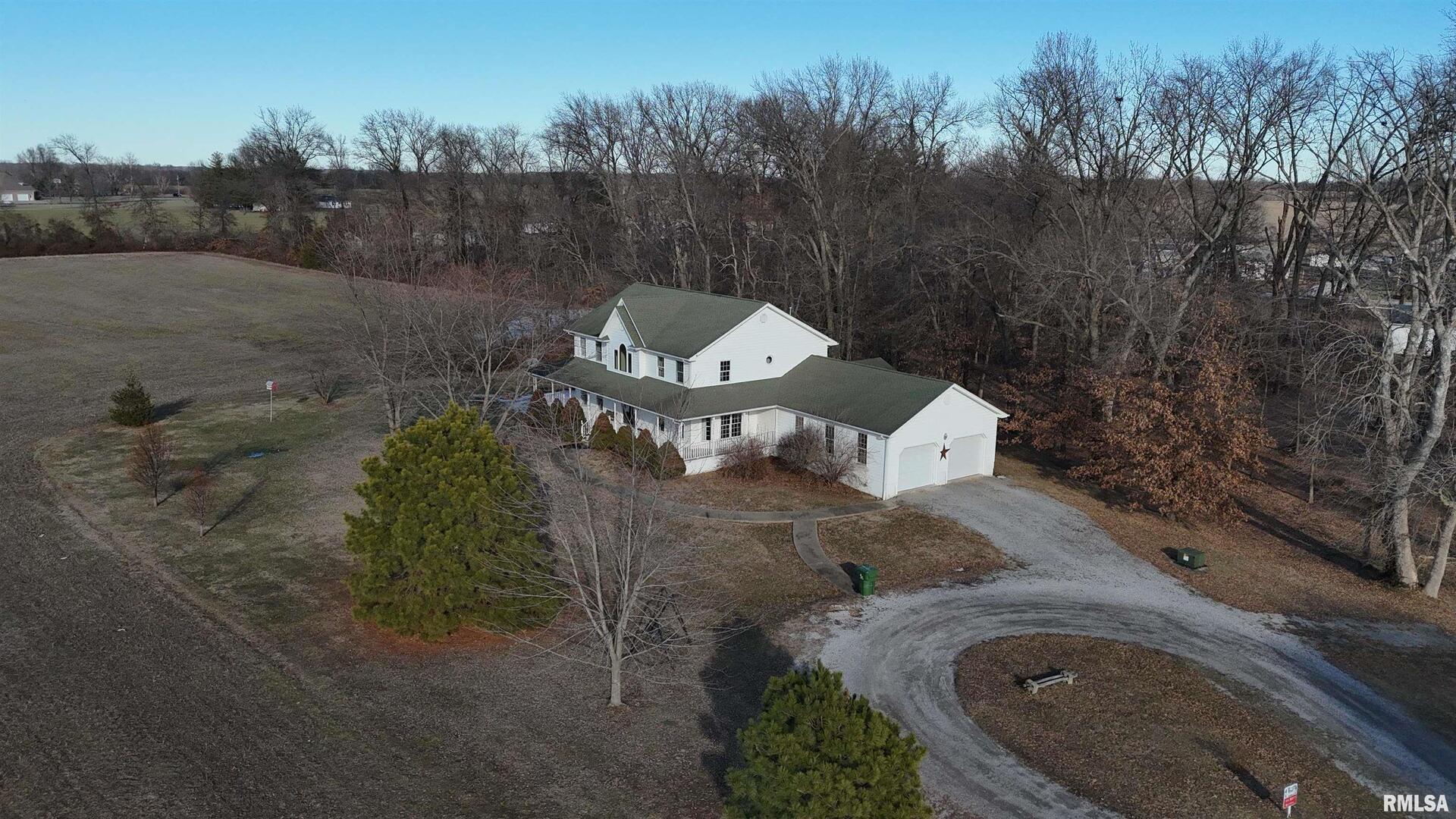 102 West North Street Ina, IL 62846 - Photo 2 of 56 a view of a house with a yard and mountain view