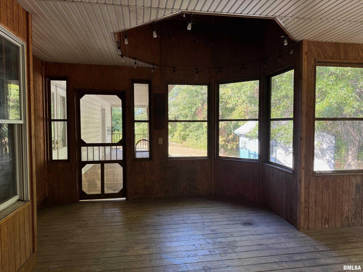 102 West North Street Benton, IL 62812 - Photo 24 of 56 a view of a room with wooden floor and a floor to ceiling window