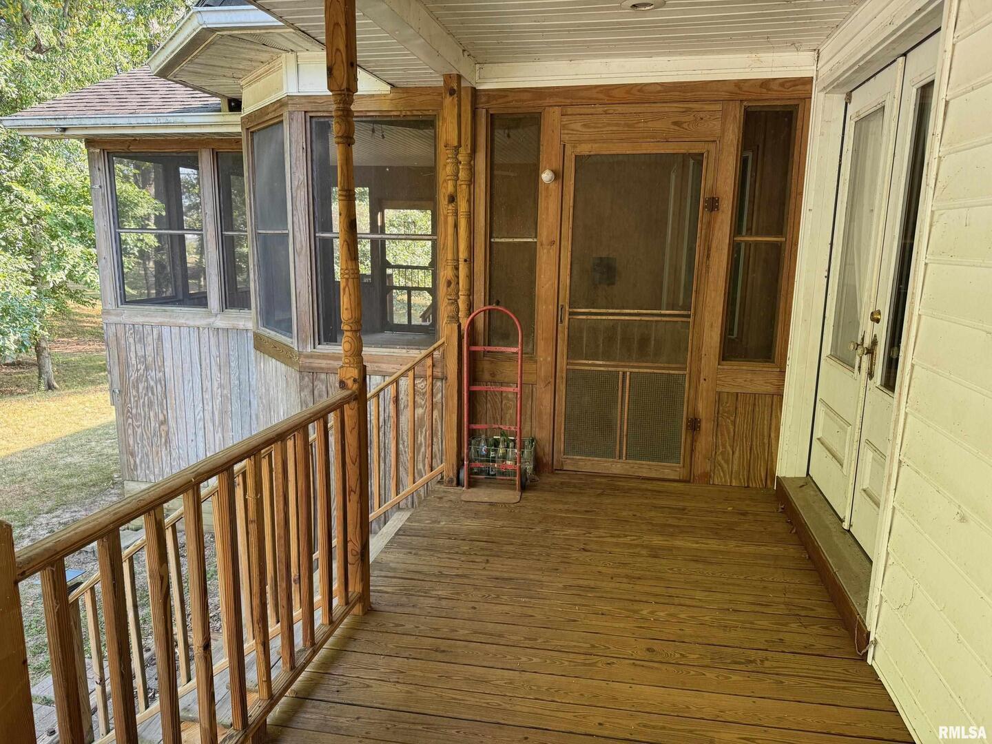 102 West North Street Benton, IL 62812 - Photo 45 of 56 a view of a porch with wooden floor and stairs