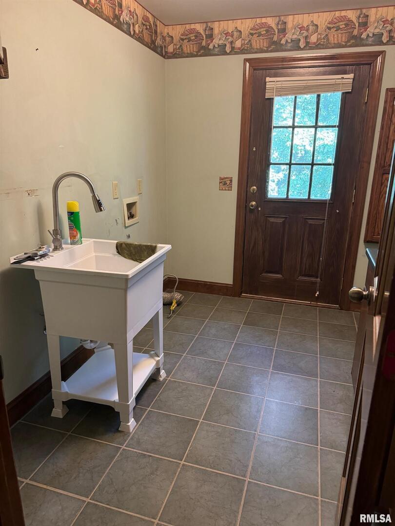 102 West North Street Benton, IL 62812 - Photo 52 of 56 a room with a sink and a mirror