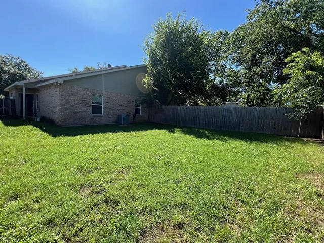 a view of a backyard with a garden
