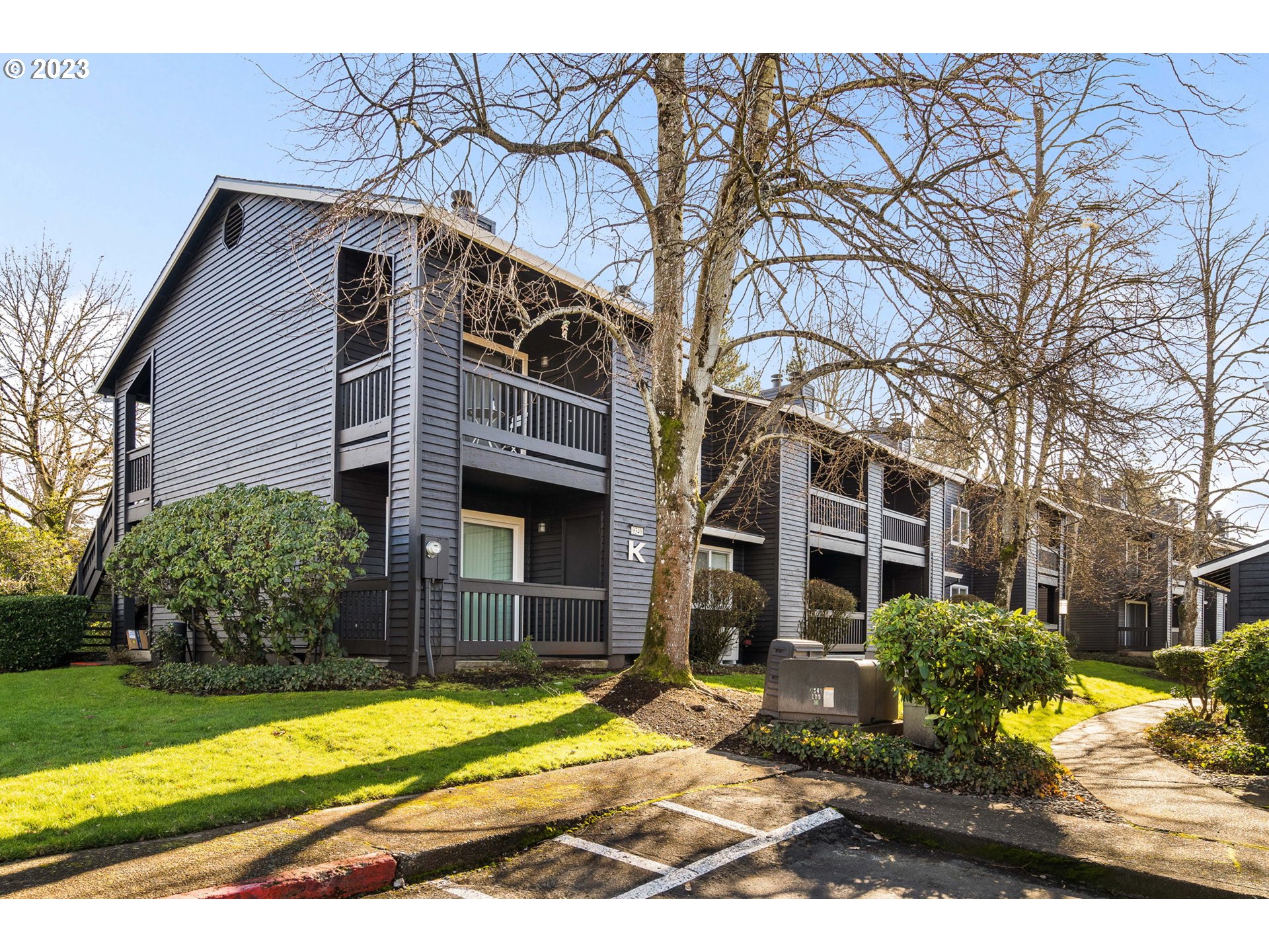 9340 Southwest 146th Terrace, Unit K7 Beaverton, OR 97007 - Photo 1 of 18 a view of a house with a yard