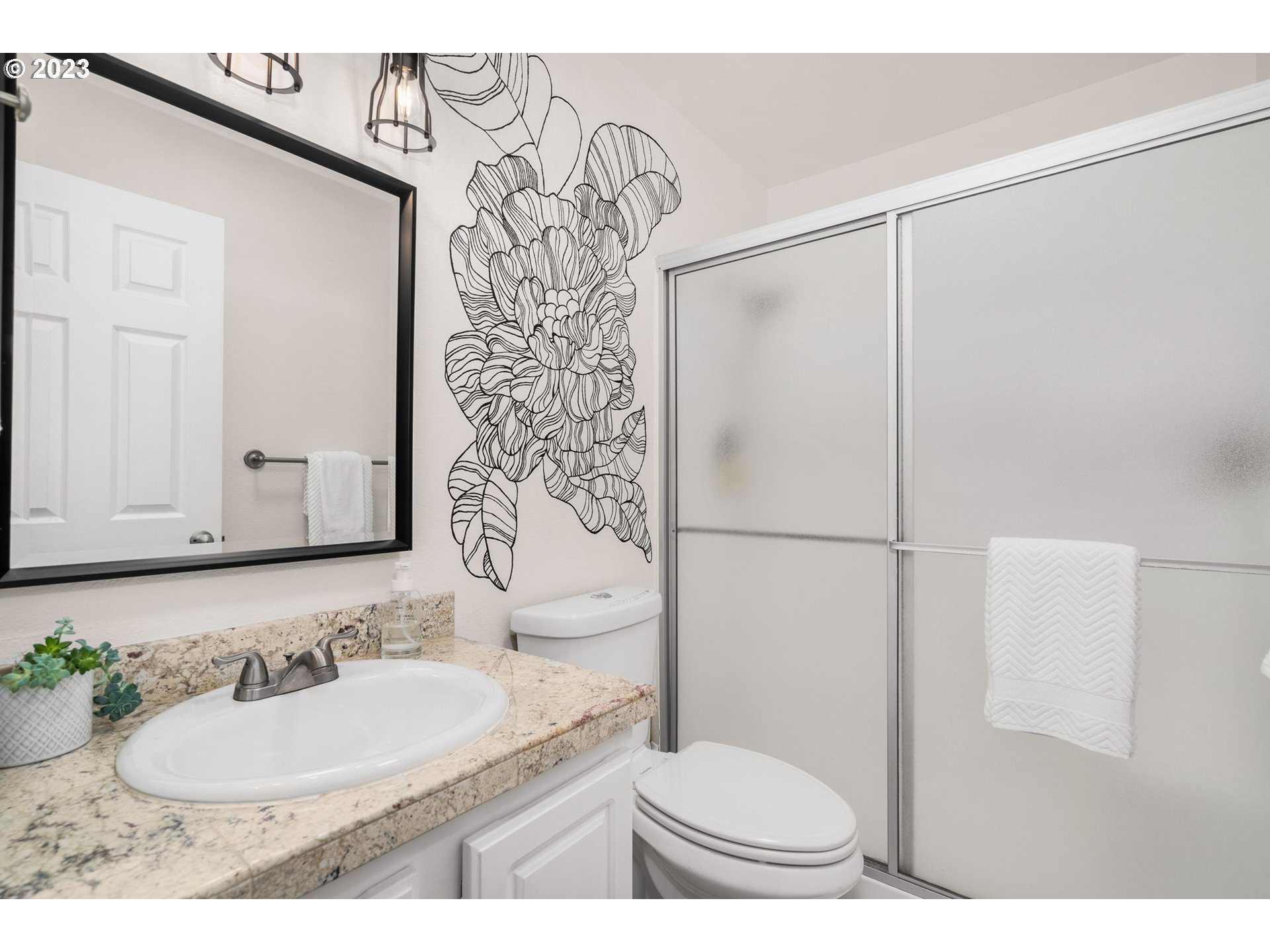 9340 Southwest 146th Terrace, Unit K7 Beaverton, OR 97007 - Photo 15 of 18 a bathroom with a granite countertop sink and a mirror