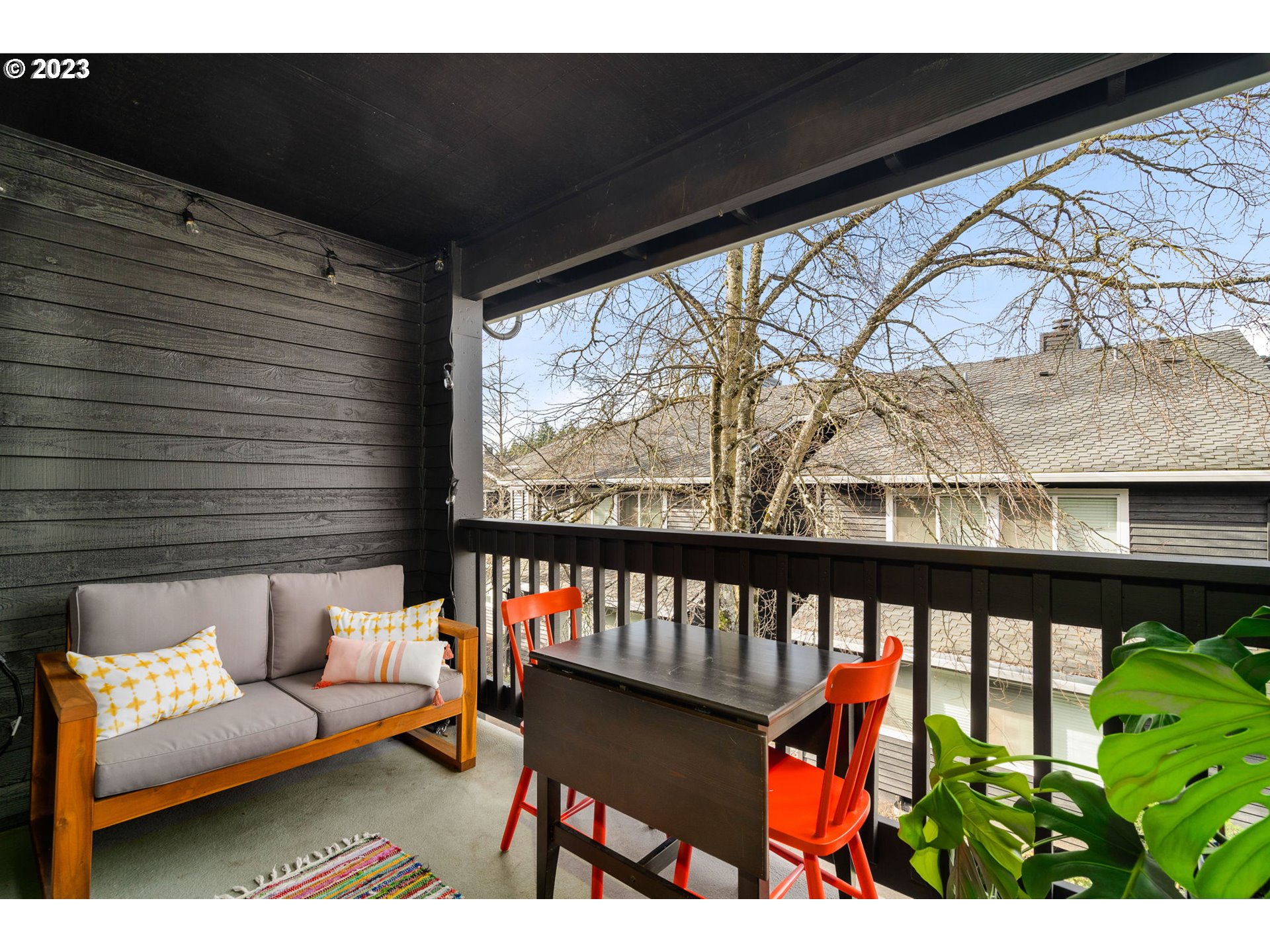 9340 Southwest 146th Terrace, Unit K7 Beaverton, OR 97007 - Photo 17 of 18 a view of a porch with furniture and a window
