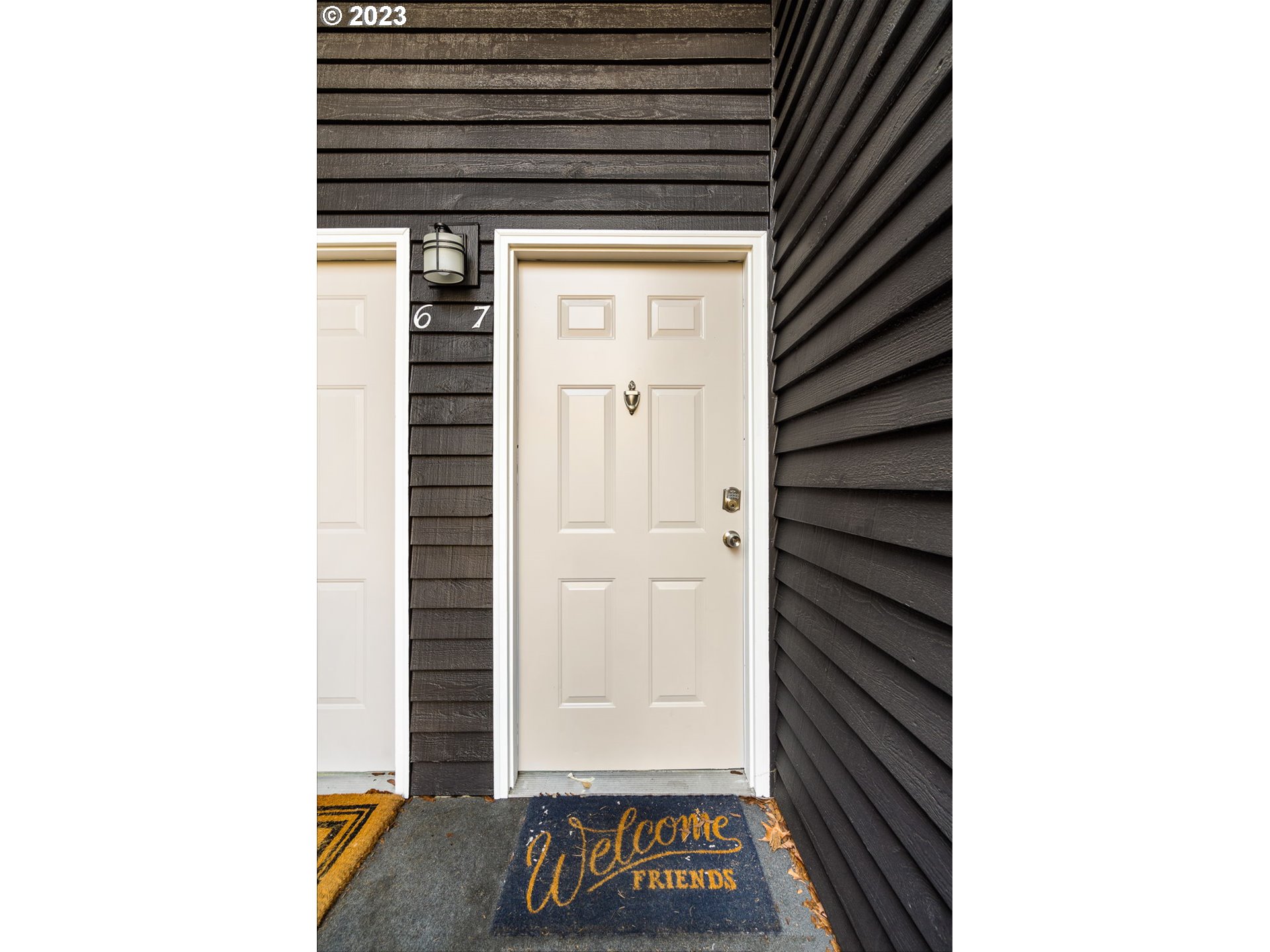 9340 Southwest 146th Terrace, Unit K7 Beaverton, OR 97007 - Photo 2 of 18 a view of door with open kitchen