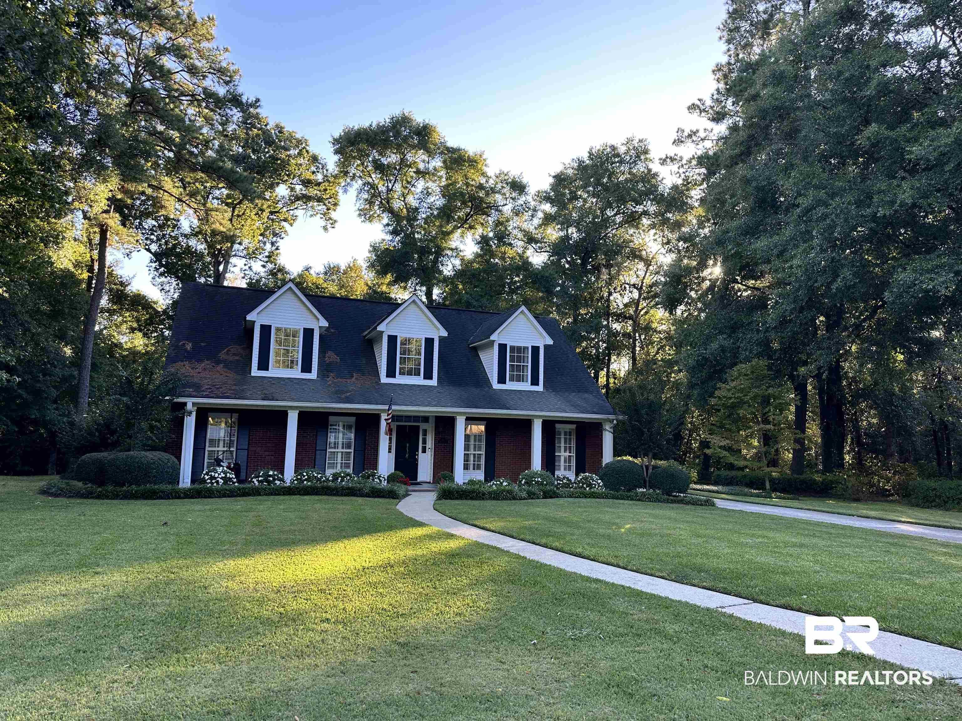 148 Brooks Boulevard Brewton, AL 36426 - Photo 39 of 45 Cape cod home featuring a front lawn and brick siding