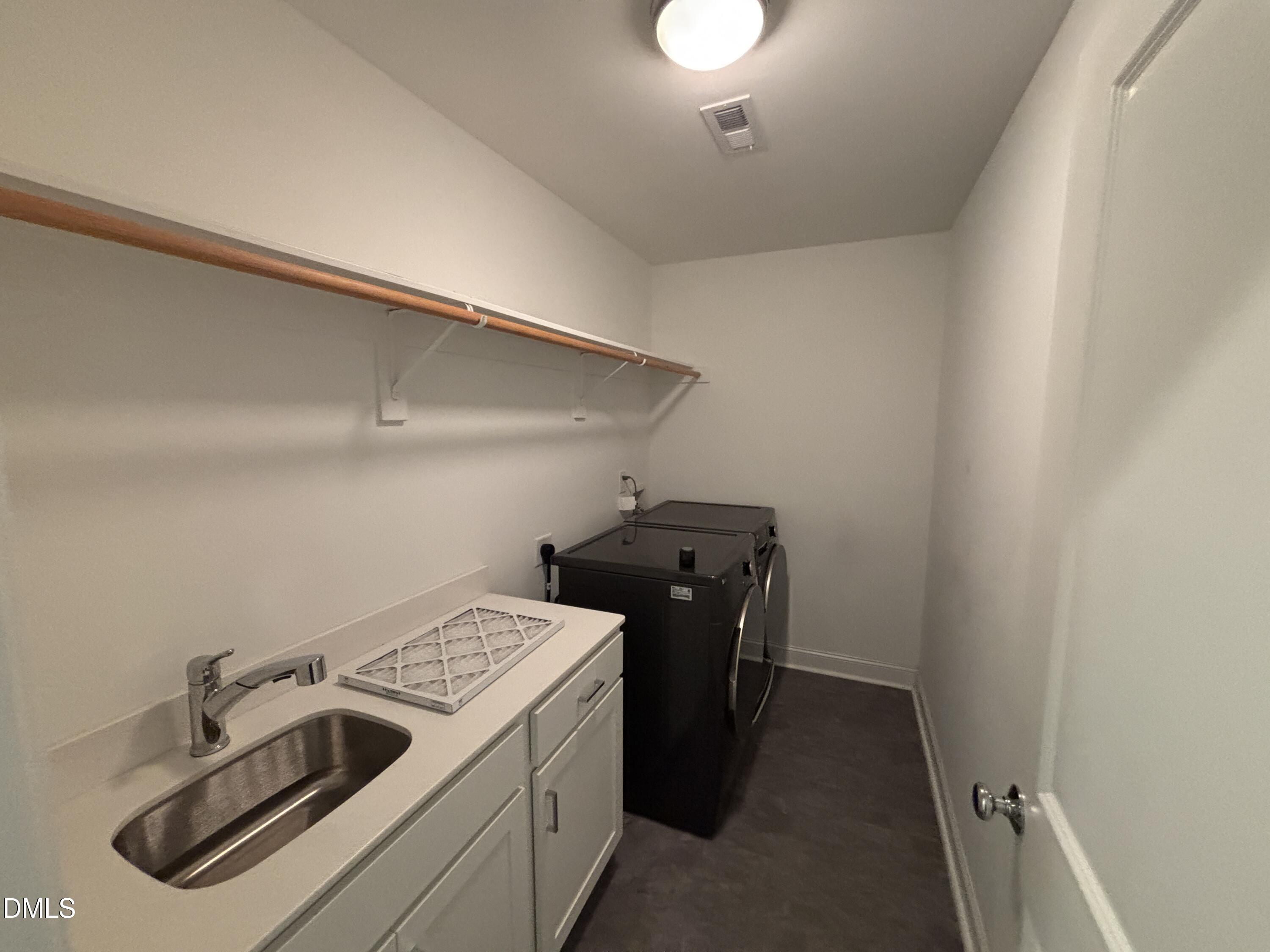 5710 Parker Pnes Court Raleigh, NC 27609 - Photo 56 of 78 a utility room with dryer and washer