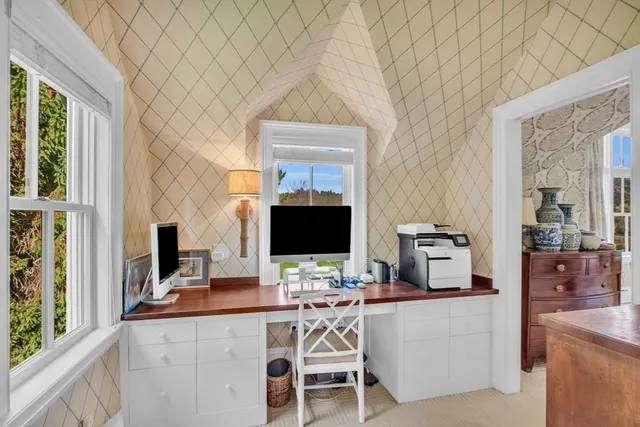 a workstation with a computer on a desk and chair