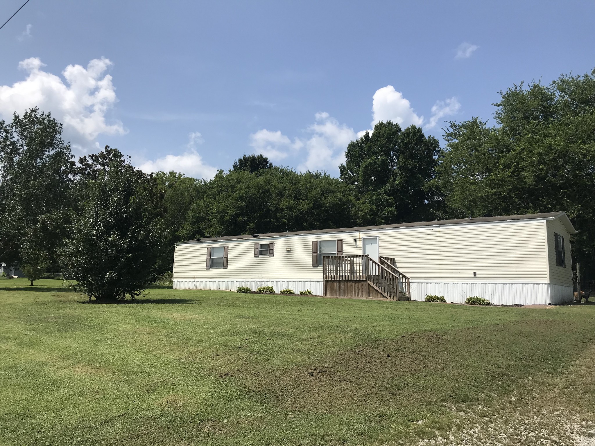 2890 Prospect Road Pulaski, TN 38478 - Photo 2 of 29 a view of a white house with a yard