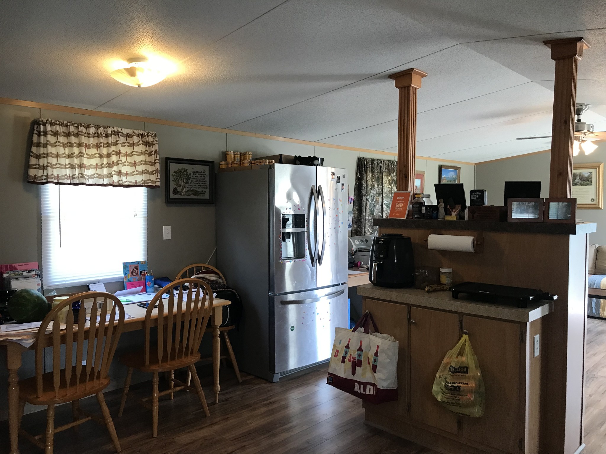 2890 Prospect Road Pulaski, TN 38478 - Photo 12 of 29 a kitchen with stainless steel appliances granite countertop a refrigerator a stove and a dining table with wooden floor
