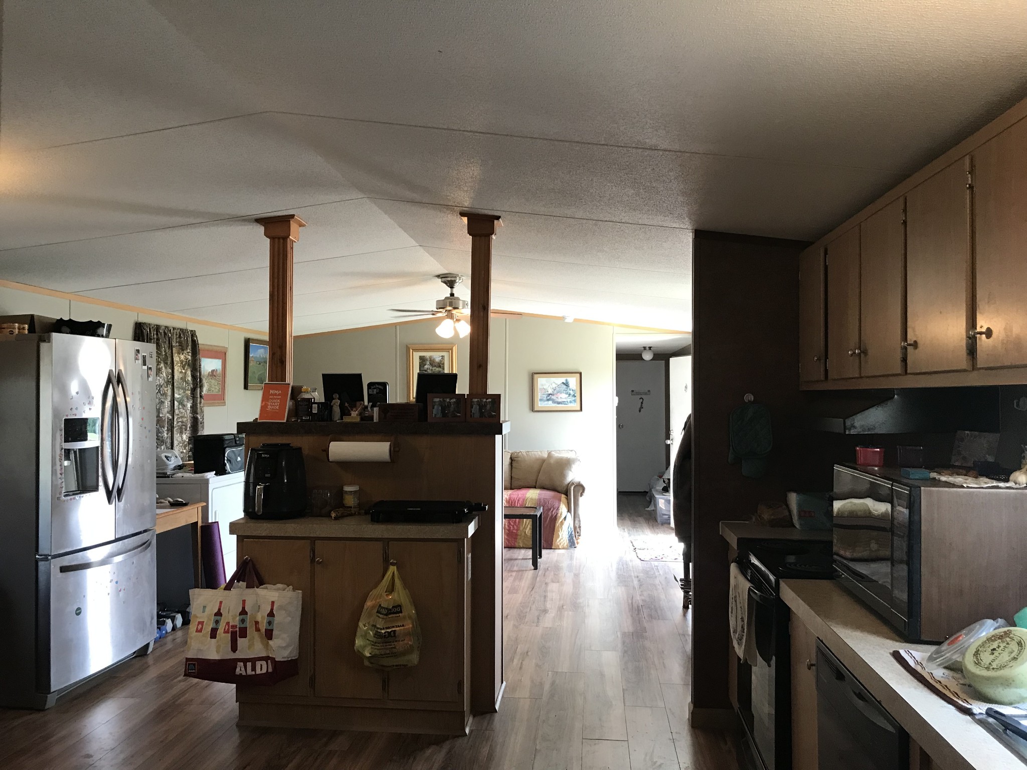 2890 Prospect Road Pulaski, TN 38478 - Photo 13 of 29 a kitchen with a refrigerator stove and wooden floor