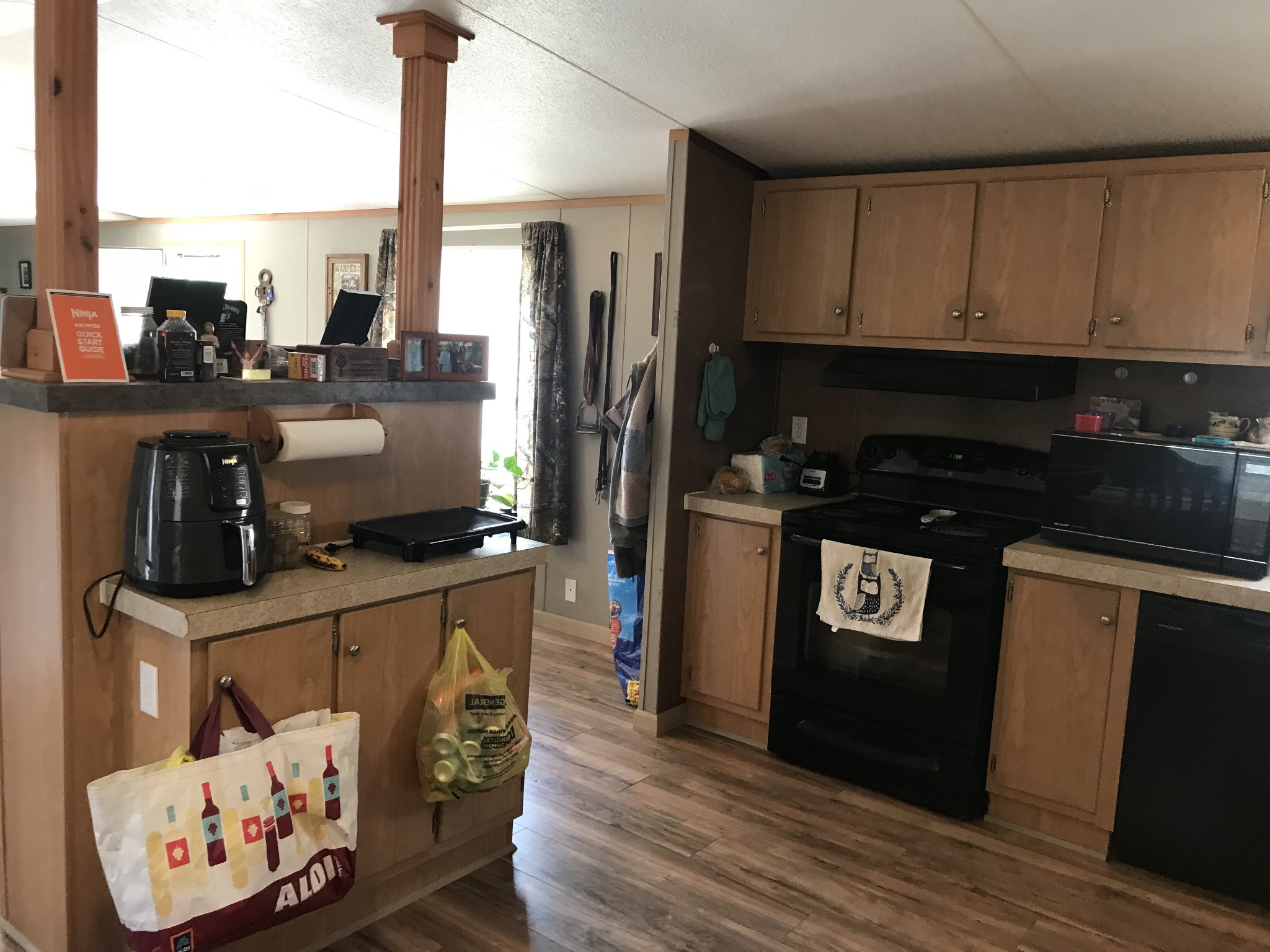 2890 Prospect Road Pulaski, TN 38478 - Photo 16 of 29 a kitchen with stainless steel appliances kitchen island granite countertop a refrigerator a stove and a sink with wooden floor