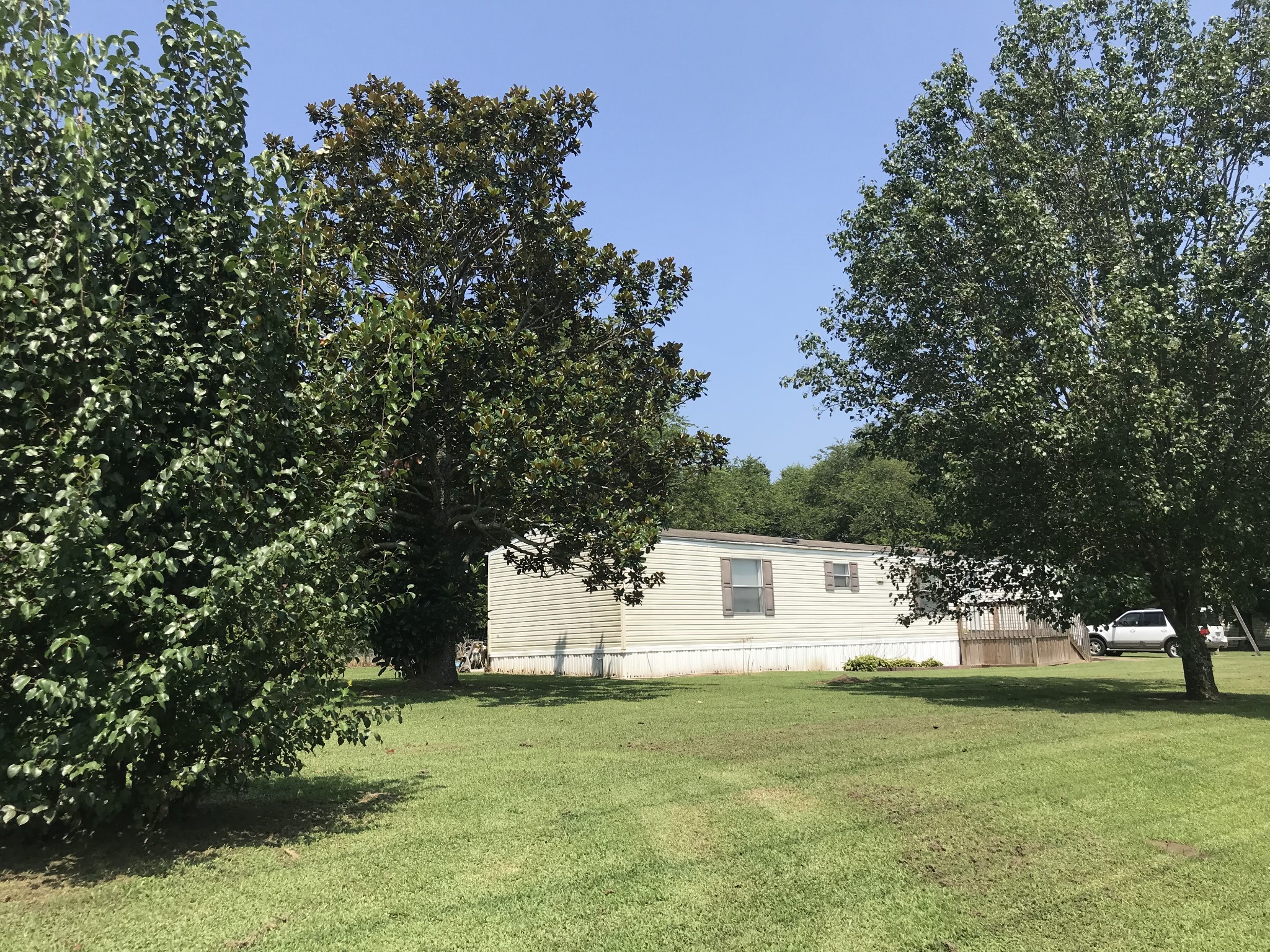 2890 Prospect Road Pulaski, TN 38478 - Photo 9 of 29 a backyard of a house with table and chairs