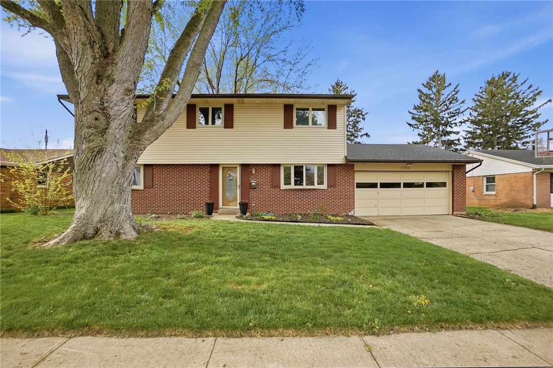 150 Littlejohn Road Troy, OH 45373 - Photo 3 of 40 This residence features a well-maintained exterior and an attached garage.