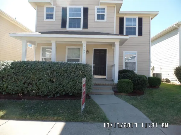 a view of a house with a garden