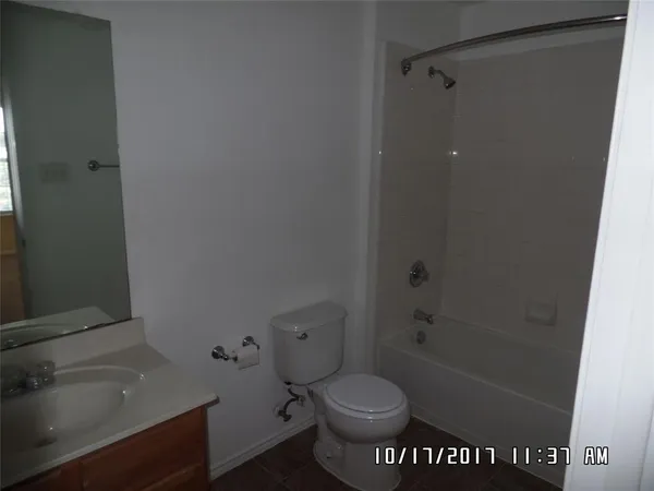 a bathroom with a toilet and a sink