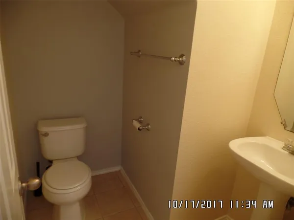 a bathroom with a toilet and a sink