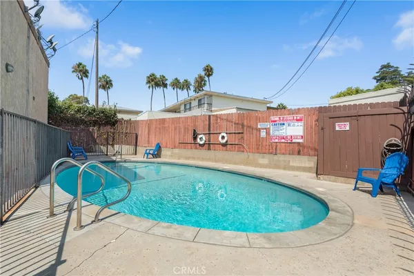 a view of a swimming pool with a patio