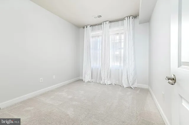 a view of room with shower and window