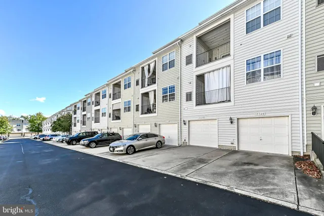 a view of a house with white door and a window