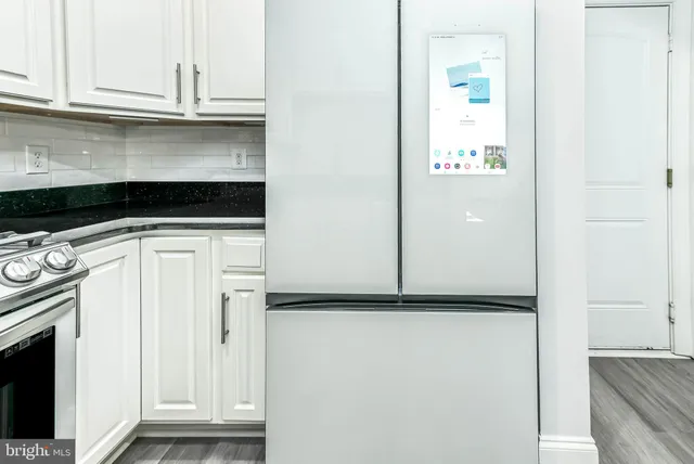 a view of a kitchen with washer and dryer