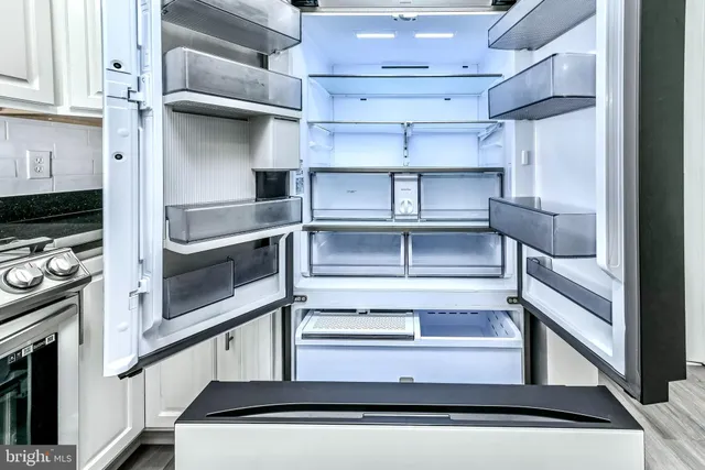 a view of a kitchen with rack on the wall