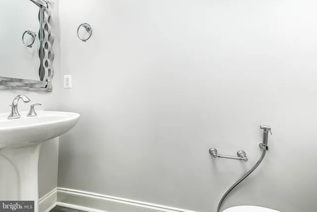 a bathroom with a sink and mirror