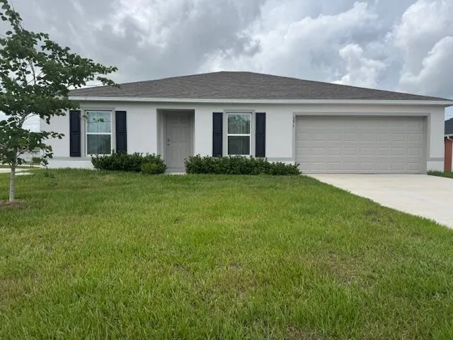 front view of a house and a yard