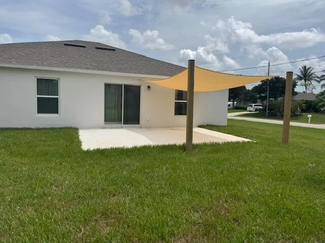 a backyard of a house with lots of green space