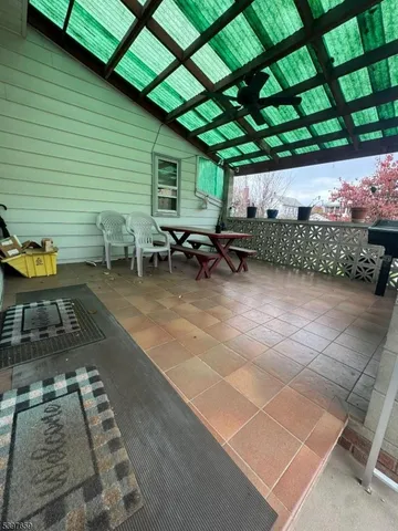 a view of a chairs and table in a backyard