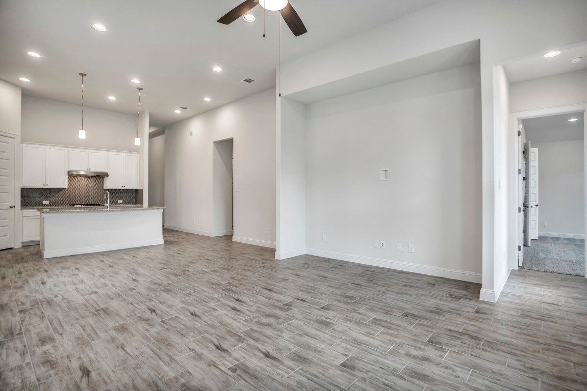 2313 Base Burner Path Leander, TX 78641 - Photo 12 of 26 a view of a kitchen with a sink and a refrigerator