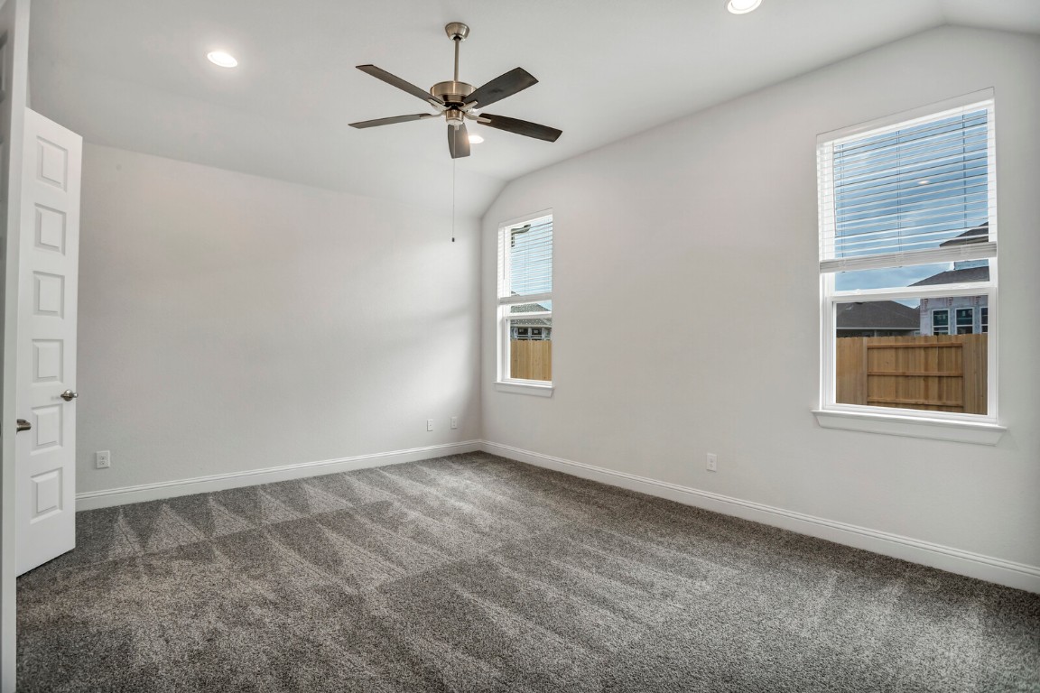 2313 Base Burner Path Leander, TX 78641 - Photo 14 of 26 an empty room with a window and a fan