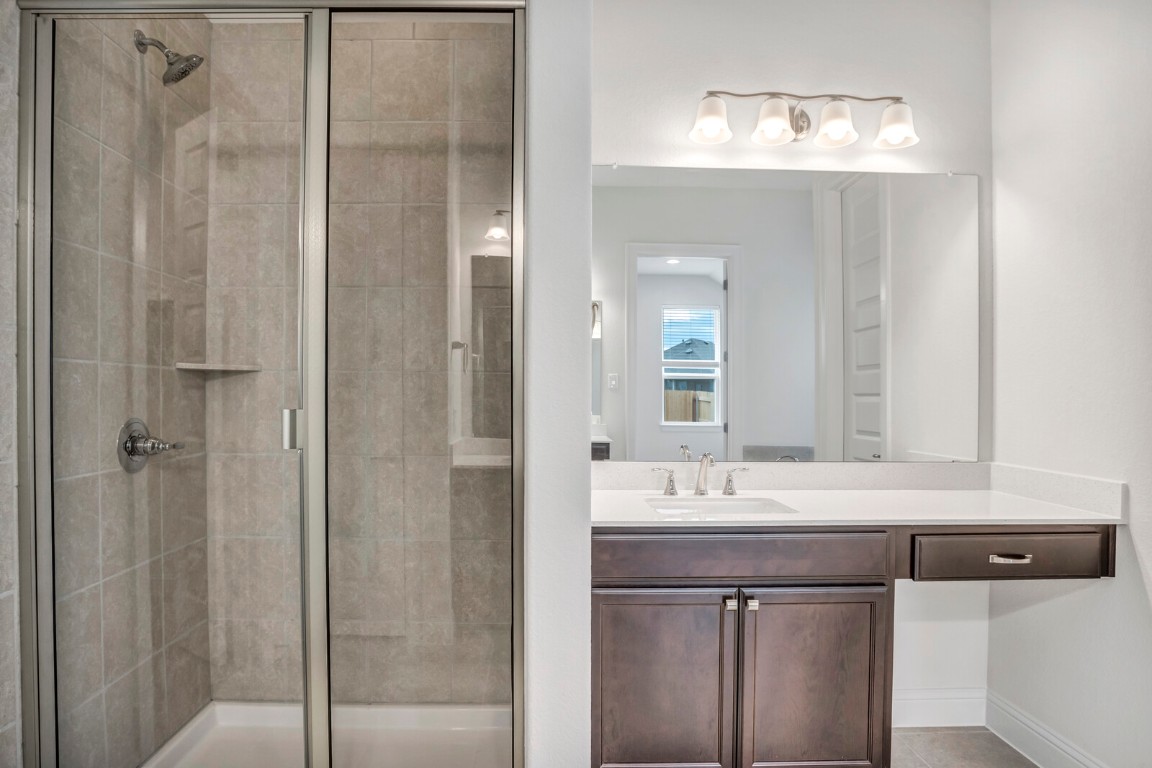 2313 Base Burner Path Leander, TX 78641 - Photo 18 of 26 a bathroom with a sink and a mirror