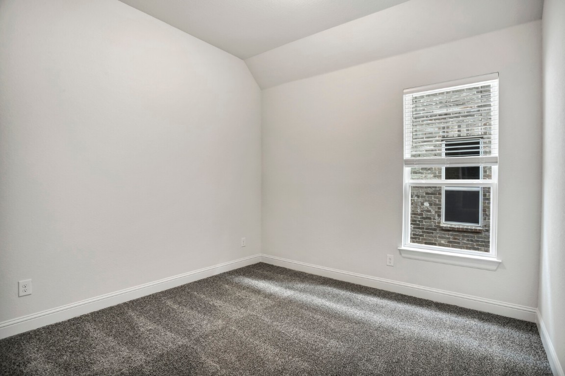 2313 Base Burner Path Leander, TX 78641 - Photo 22 of 26 an empty room with a window