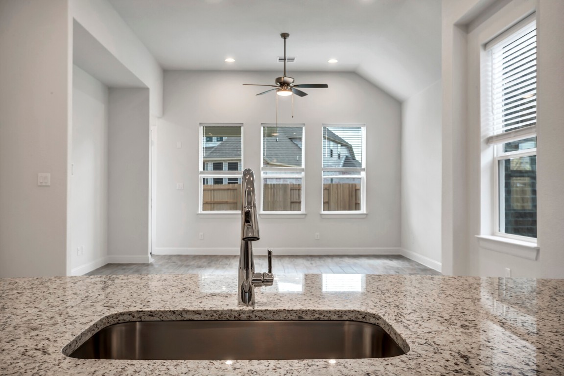 2313 Base Burner Path Leander, TX 78641 - Photo 9 of 26 a kitchen with granite countertop a sink and a window