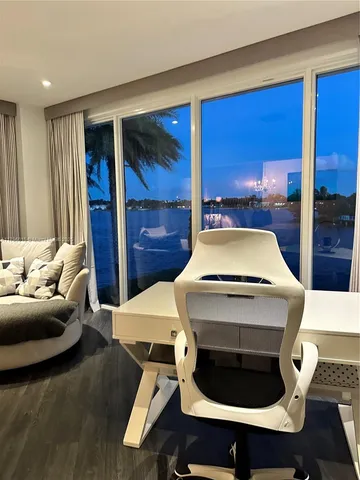 a living room with a bed furniture and a fireplace