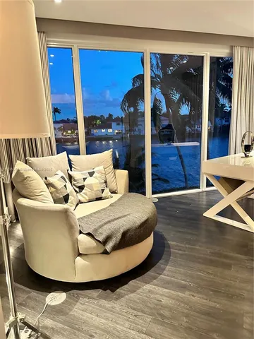 a living room with furniture and window
