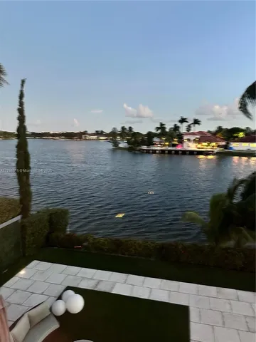 a view of lake from next to a yard