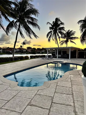 a view of swimming pool with outdoor seating