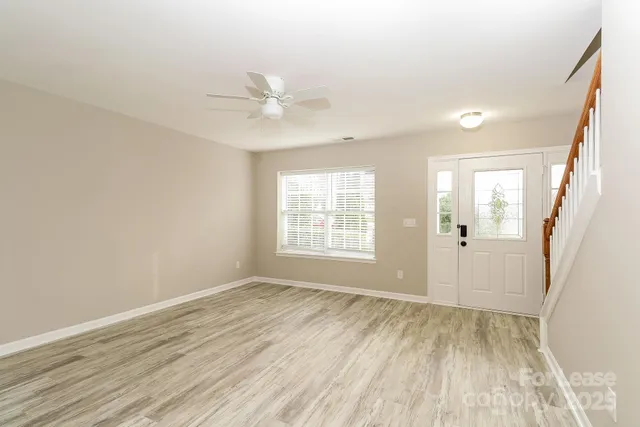 a kitchen with stainless steel appliances granite countertop a stove top oven a sink and a refrigerator