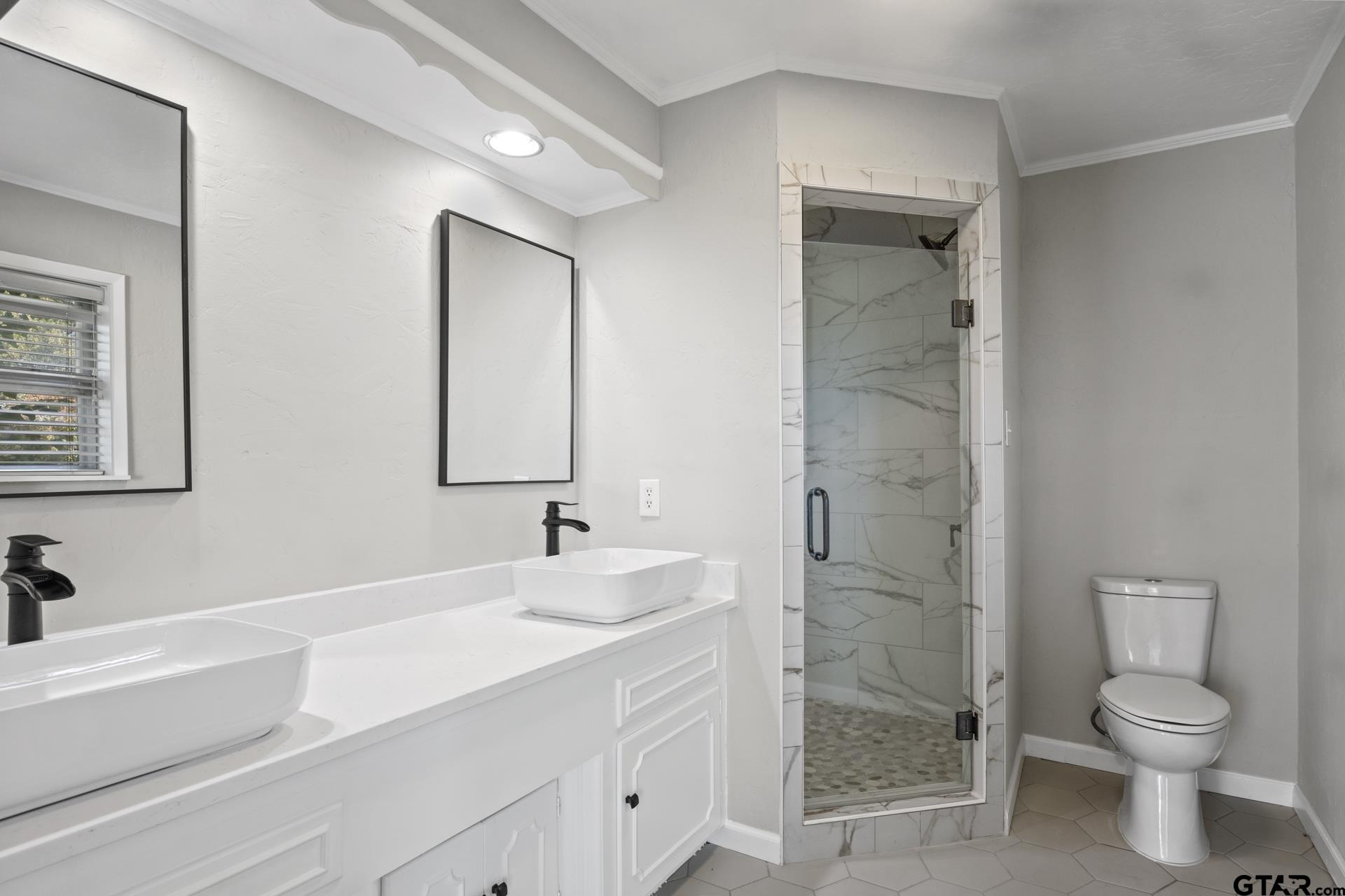 331 County Road 2106 Pittsburg, TX 75686 - Photo 15 of 32 a bathroom with a sink a toilet and shower