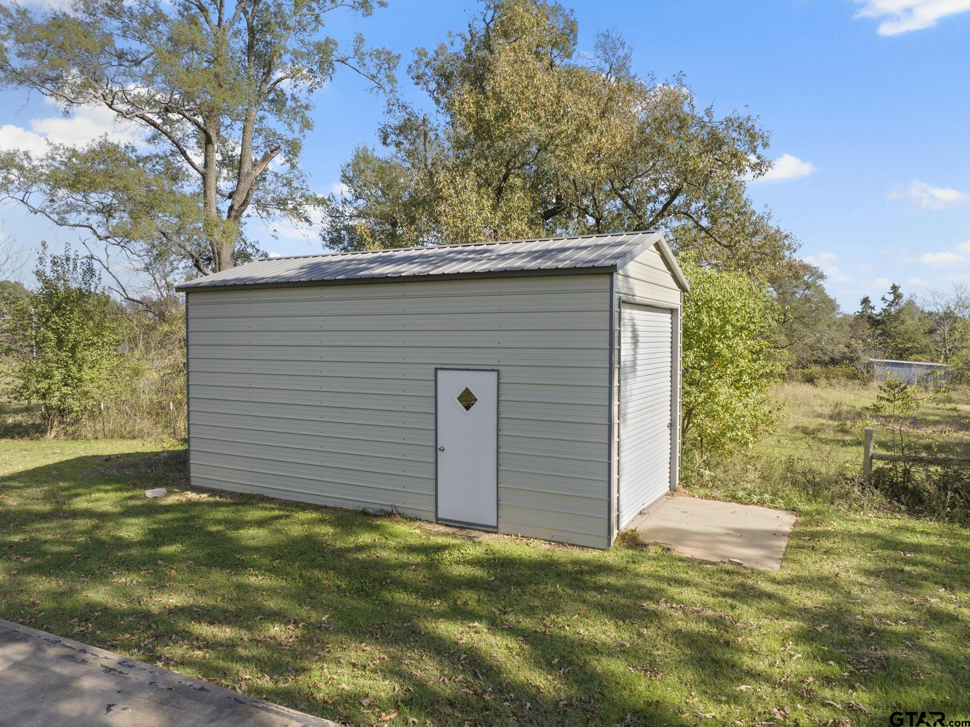 331 County Road 2106 Pittsburg, TX 75686 - Photo 21 of 32 a view of a backyard