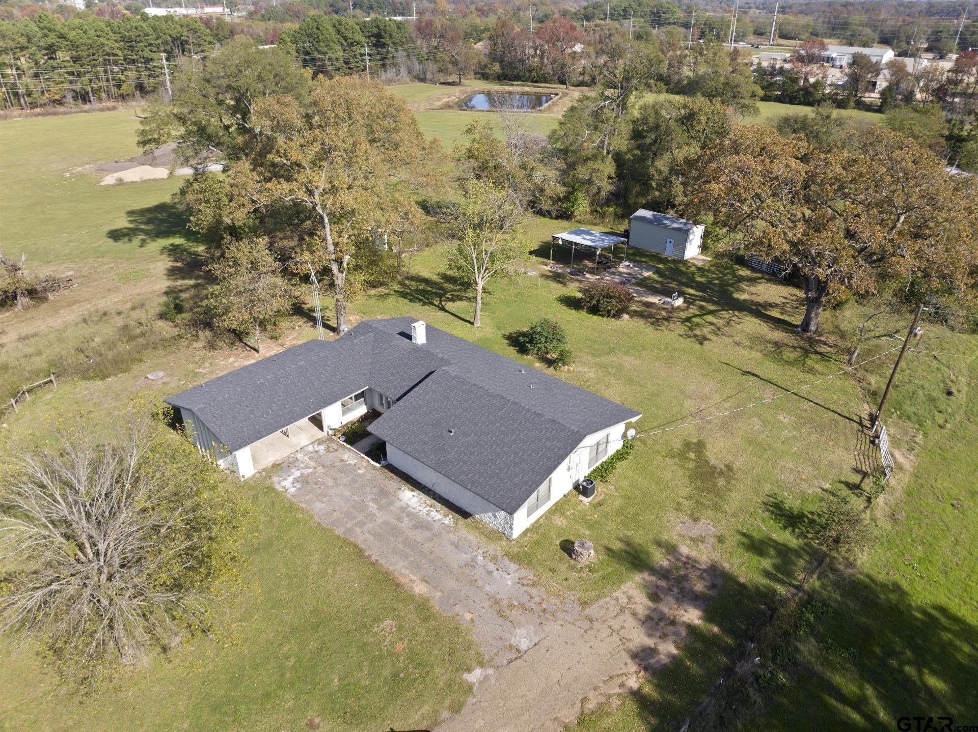 331 County Road 2106 Pittsburg, TX 75686 - Photo 23 of 32 an aerial view of residential houses with outdoor space
