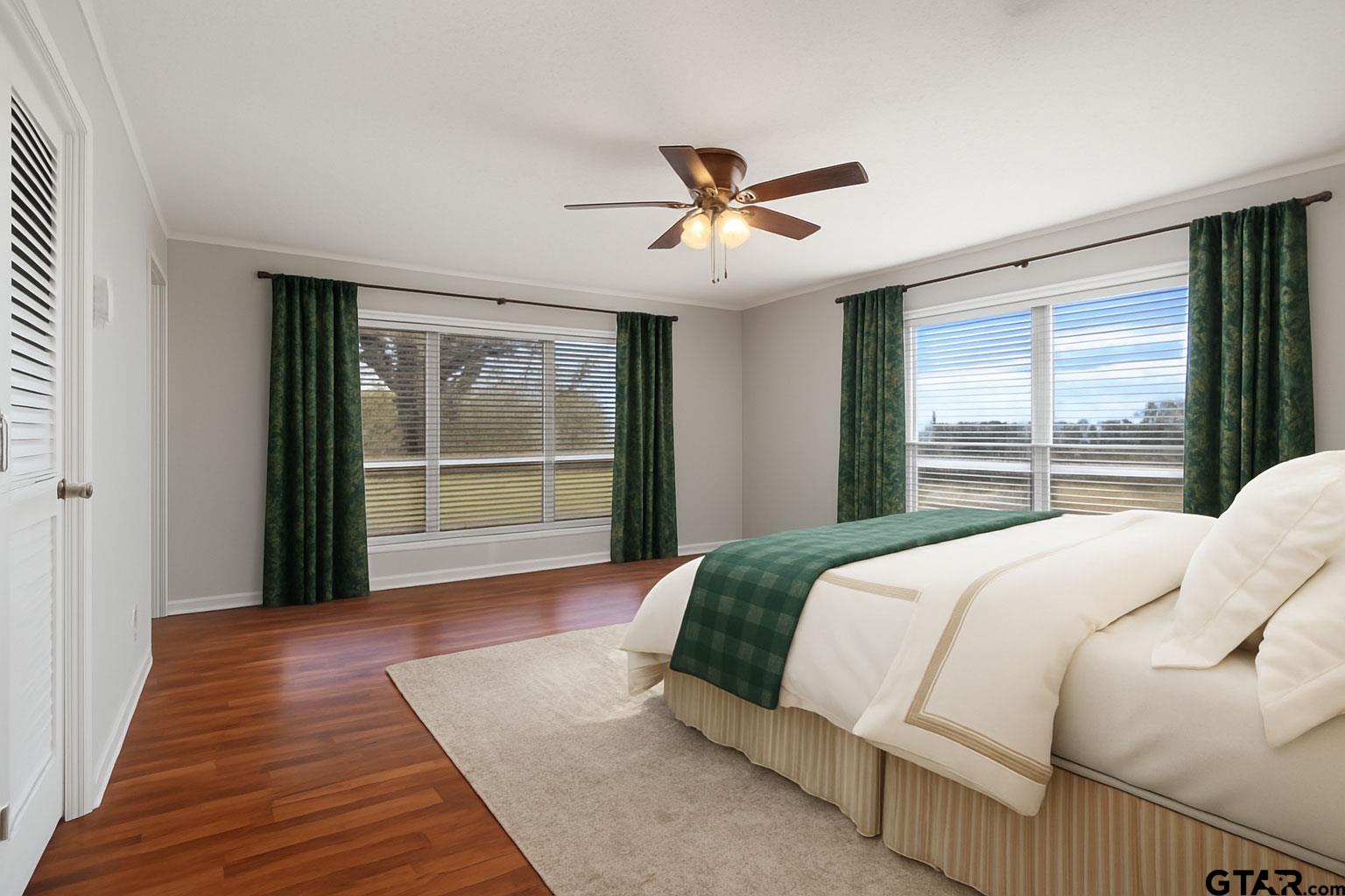 331 County Road 2106 Pittsburg, TX 75686 - Photo 29 of 32 a bedroom with a large bed and a large window