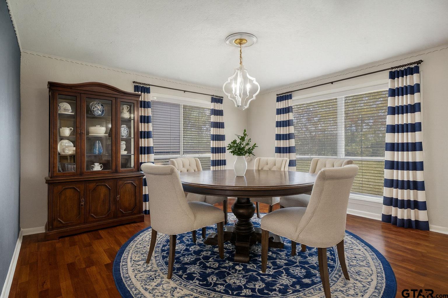 331 County Road 2106 Pittsburg, TX 75686 - Photo 32 of 32 a view of a dining room with furniture window and wooden floor