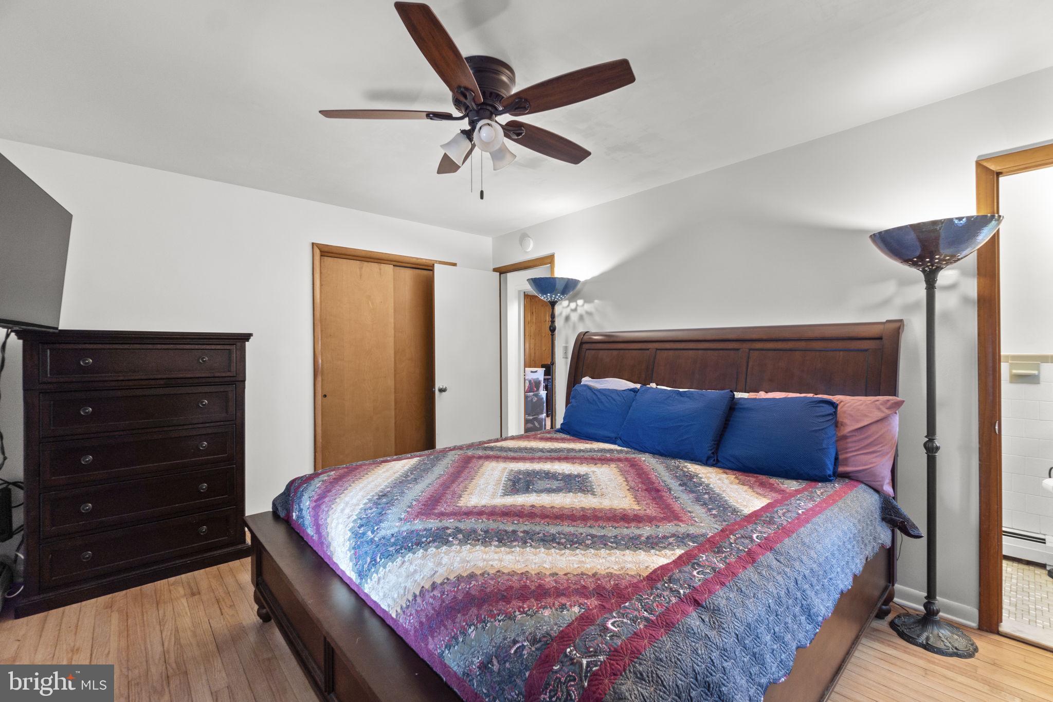 2401 Albert Rill Road Hampstead, MD 21074 - Photo 17 of 38 a bedroom with a bed and a dresser