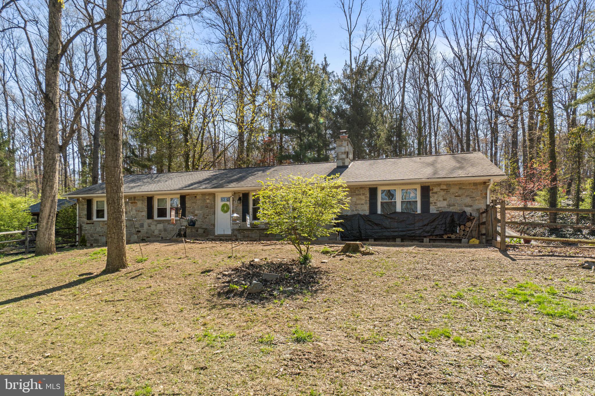 2401 Albert Rill Road Hampstead, MD 21074 - Photo 2 of 38 a front view of a house with a yard covered with snow